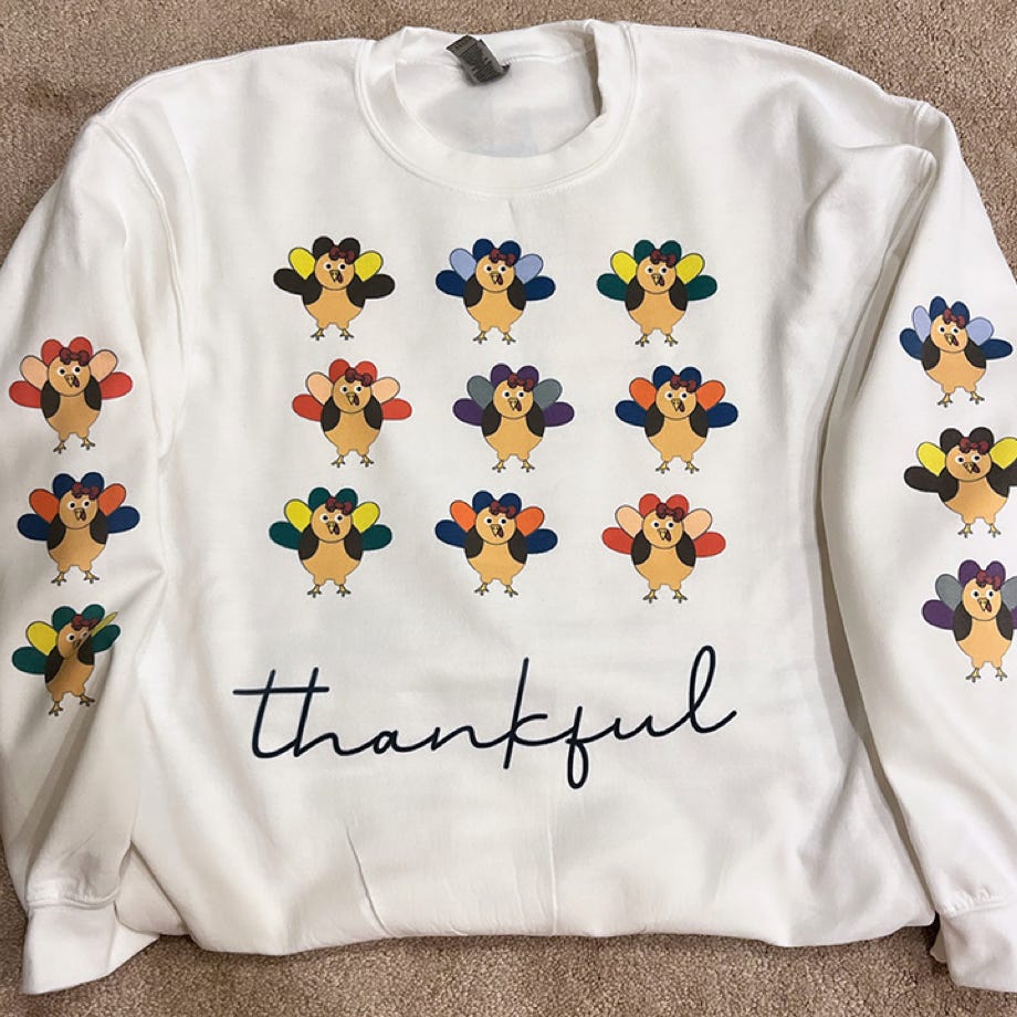 A woman in a white bikini standing on rocks